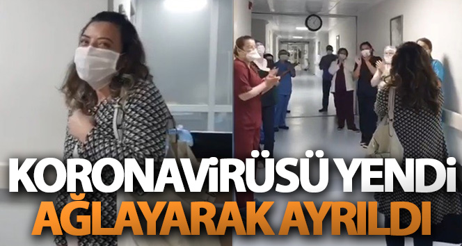 Korona virüsü yenen hemşire meslektaşlarının alkışlarıyla, ağlayarak hastaneden ayrıldı